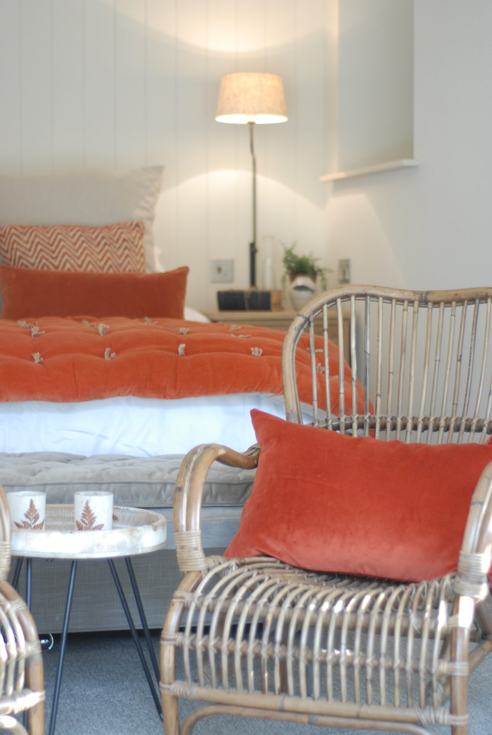 Cosy rattan armchairs with pop of colour